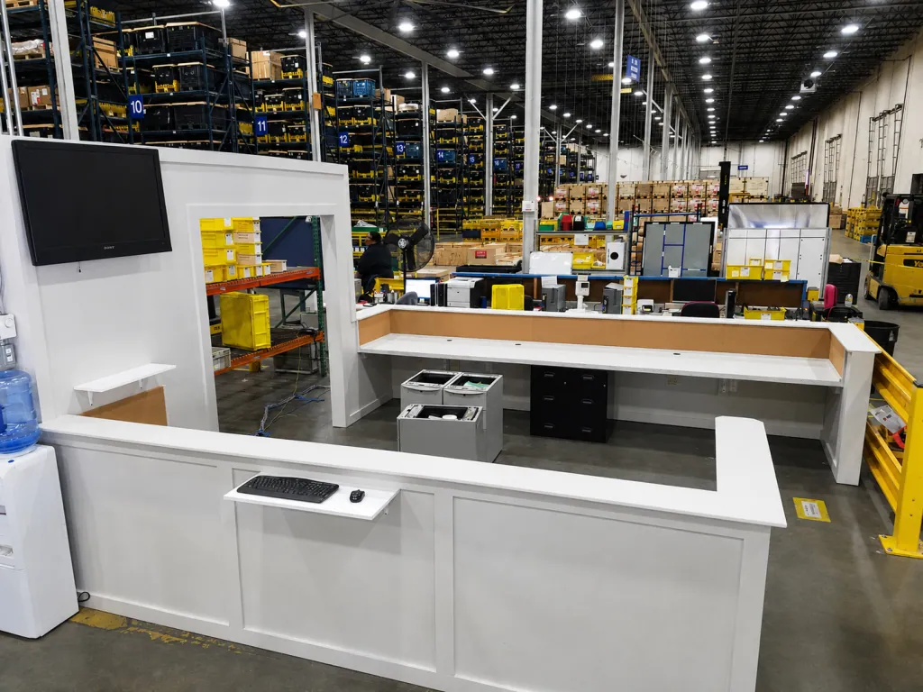 Installation of Custom Industrial Warehouse workstation. electrical. data. guard rails. office furniture